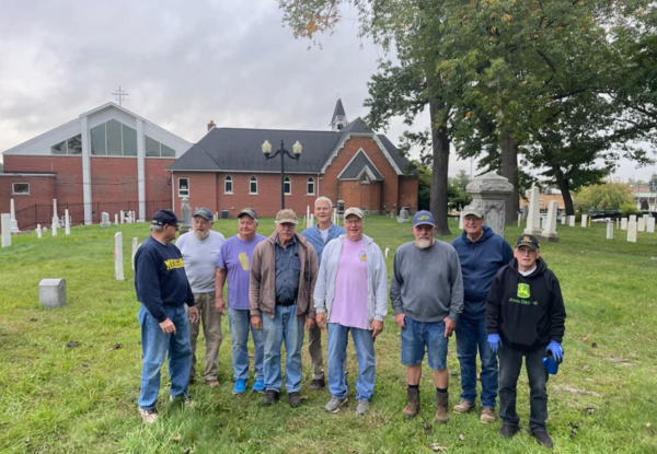 Volunteers Continue Headstone Restorations at Old Village Cemetery