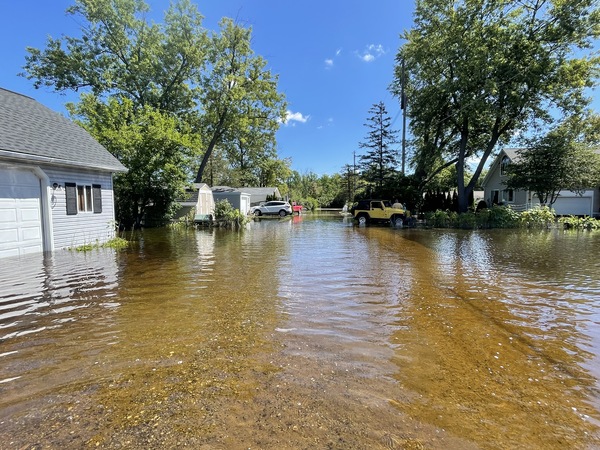 Huron River Flood Waters Inundate Homes Along Ore Lake