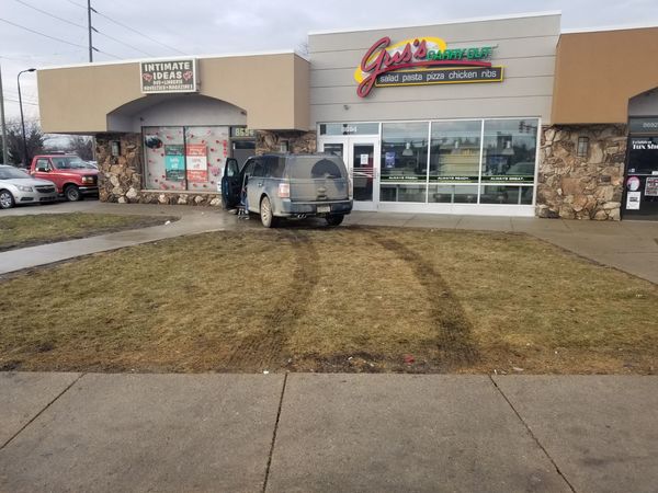 SUV Crashes Into Parked Jeep, Comes To Rest Against Brighton Plaza Building