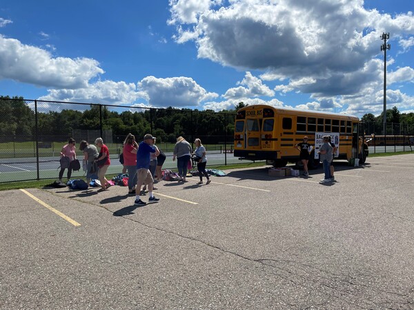 Local Families, Students Line Up For Backpacks & Supplies