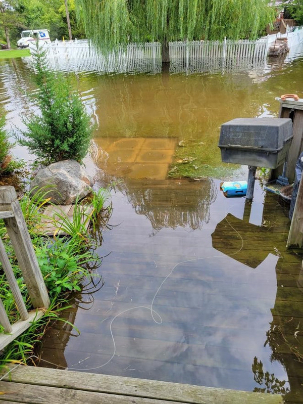 Huron River Flood Waters Inundate Homes Along Ore Lake