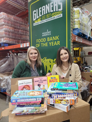 Women United Donates Books & Puzzles For Holiday Food Boxes