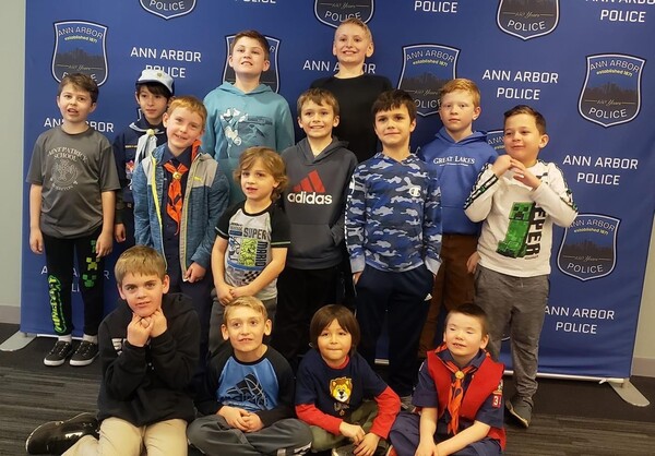 Cub Scout Pack Collecting Food Items During Brighton Parade