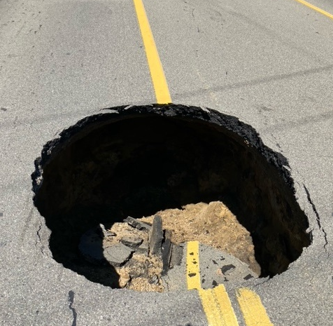 Large Sinkhole Forces Emergency Closure Of North Wixom Road