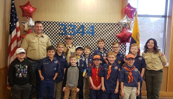 Cub Scout Pack Collecting Food Items During Brighton Parade
