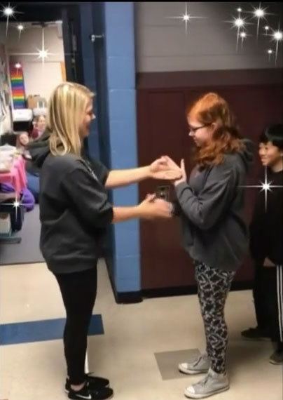 South Lyon Teacher Has Personalized Handshakes With Students
