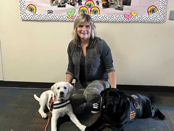 Brighton Teacher Honored for Starting Pack of Dogs Program