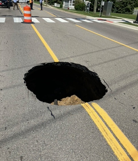 Large Sinkhole Forces Emergency Closure Of North Wixom Road