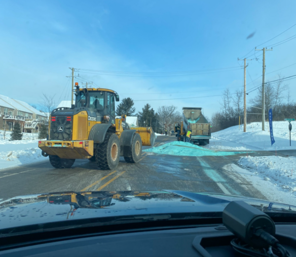 Car Trapped In Pile After Salt Truck Spill