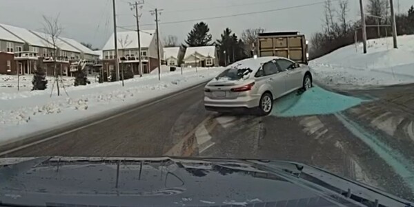 Car Trapped In Pile After Salt Truck Spill