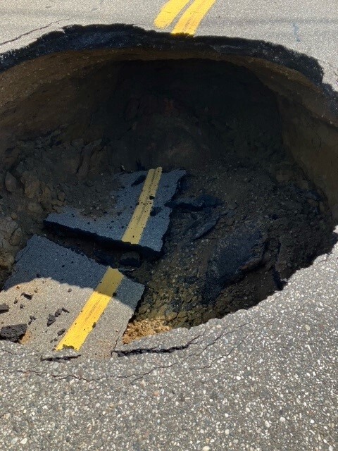 Large Sinkhole Forces Emergency Closure Of North Wixom Road